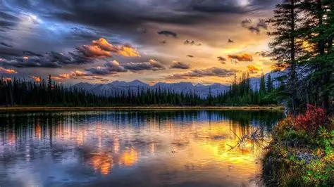 Peaceful lake and mountain view at sunset
